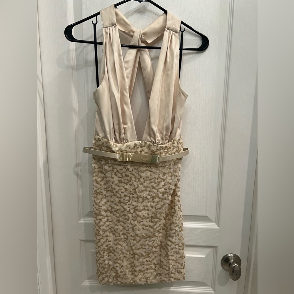 Bebe, champagne colored, halter, sequin dress. Size Small